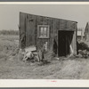 Tarpaper dwelling occupied by person living in abandoned lumber camp, Gemmel, Minnesota