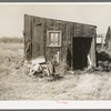 Tarpaper dwelling occupied by person living in abandoned lumber camp, Gemmel, Minnesota