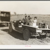 Children of Indian blueberry pickers in truck. Note boxes for blueberries and clothes, near Littlefork, Minnesota