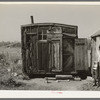 Tar paper dwelling occupied by family living in abandoned lumber cap, Gemmel, Minnesota