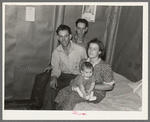 Family and brother-in-law living in tarpaper shack in abandoned lumbercamp, Gemmel, Minnesota