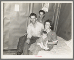 Family and brother-in-law living in tarpaper shack in abandoned lumbercamp, Gemmel, Minnesota