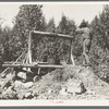 Old miner with his homemade windlass near Winton, Minnesota