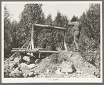 Old miner with his homemade windlass near Winton, Minnesota