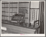 Cash register and empty shelves in closed store. Babbitt, Minnesota, "bust" iron mining town