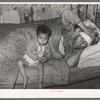 Mexican father and child. San Antonio, Texas. This family was living on relief. The father was obviously very sick. He said he had kidney trouble. He was having no medical attention