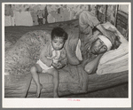 Mexican father and child. San Antonio, Texas. This family was living on relief. The father was obviously very sick. He said he had kidney trouble. He was having no medical attention