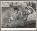 Mexican father and child. San Antonio, Texas. This family was living on relief. The father was obviously very sick. He said he had kidney trouble. He was having no medical attention