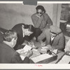 Mexican pecan worker being assigned to work by union. San Antonio, Texas