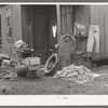 Clothing and personal belongings outside of house in Mexican quarter. San Antonio, Texas