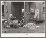 Clothing and personal belongings outside of house in Mexican quarter. San Antonio, Texas