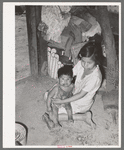 Mexican children in kitchen. San Antonio, Texas