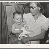 Mexican mother with child with impetigo. Crystal City, Texas