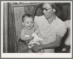 Mexican mother with child with impetigo. Crystal City, Texas