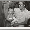 Mexican mother with child with impetigo. Crystal City, Texas