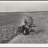 Breaking virgin soil by means of tractor-drawn plow. El Indio, Texas