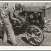 Son of pioneer at El Indio, Texas, repairing clutch on tractor