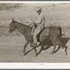 Cowboy on horseback near Eagle Pass, Texas