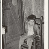 Mexican boy in corner of room. San Antonio, Texas