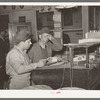 Looking over the day's orders in a commission house adjacent to the large fruit and vegetable market in San Antonio, Texas