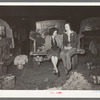 Wives of vegetable peddlers sometimes accompany their husbands to the early morning market. San Antonio, Texas