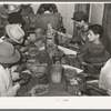 Mexican pecan shellers removing nuts from shells, non-union plant. San Antonio, Texas