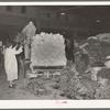 Unloading trucks at vegetable market. San Antonio, Texas