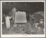 Unloading trucks at vegetable market. San Antonio, Texas