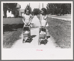 Little girls with their dolls and buggies, Caldwell, Idaho