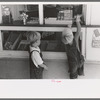 Little boys buy some candy, Caldwell, Idaho