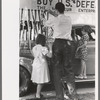 Decorating their automobile for the Fourth of July parade at Vale, Oregon