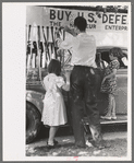 Decorating their automobile for the Fourth of July parade at Vale, Oregon