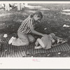 Even at a Fourth of July picnic baby brother must have his nap, Vale, Oregon