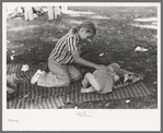 Even at a Fourth of July picnic baby brother must have his nap, Vale, Oregon