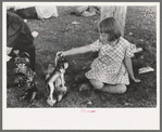 Little girl plays with prizes won at concession, Fourth of July, Vale, Oregon