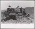 Gasoline, fuel oil and lubricants are carried to tractor and combine in wheat field. Eureka Flats, Walla Walla County, Washington