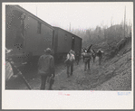 Lumberjacks get off the "crummies" when they arrive in the woods. Long Bell Lumber Company, Cowlitz County, Washington