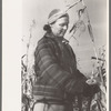 Farmer (widow) husking corn. She lives on Black Canyon Project and has a FSA (Farm Security Administration) loan, Canyon County, Idaho