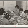 Mexican women separating meat from shells. Pecan shelling plant. San Antonio, Texas