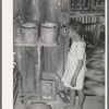 Daughter of Negro sharecropper drinking from hollow gourd. Near Marshall, Texas