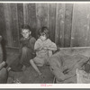 Two children of family living on relief near Jefferson, Texas. These children did not attend school because of lack of warm clothes and indifference of mother who was sick with pellagra. Note baby's cradle