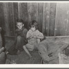 Two children of family living on relief near Jefferson, Texas. These children did not attend school because of lack of warm clothes and indifference of mother who was sick with pellagra. Note baby's cradle