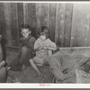 Two children of family living on relief near Jefferson, Texas. These children did not attend school because of lack of warm clothes and indifference of mother who was sick with pellagra. Note baby's cradle