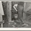 Dipping water from well near Marshall, Texas