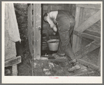Dipping water from well near Marshall, Texas