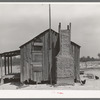 Home of tenant farmer with mud and straw chimney. Near Marshall, Texas