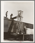 Icing refrigerator cars for shipment of strawberries. Hammond, Louisiana