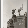 Icing refrigerator cars for shipment of strawberries. Hammond, Louisiana