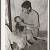 Negro strawberry picker with her baby. Independence, Louisiana