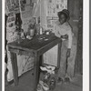 Corner of room of living quarters provided for Negro strawberry pickers near Independence, Louisiana